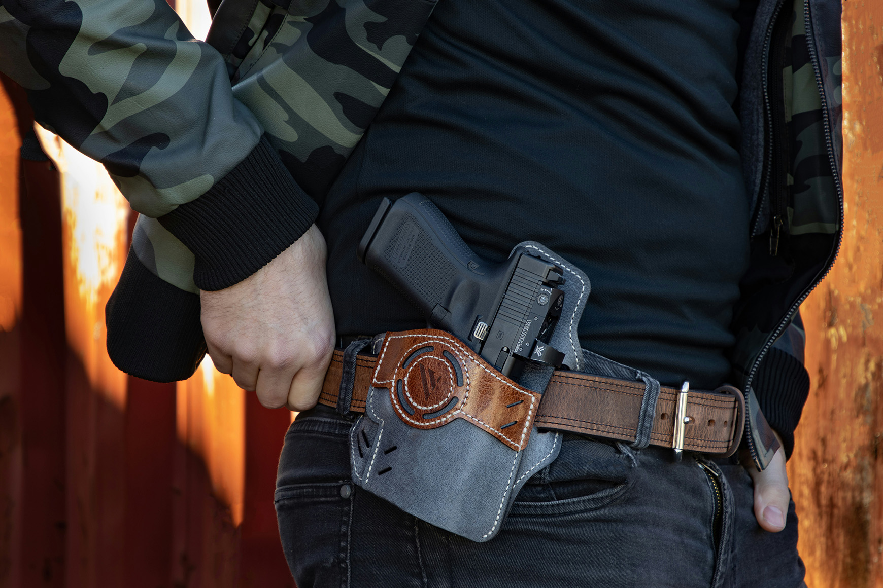 Civilian wearing concealed carry holster on belt